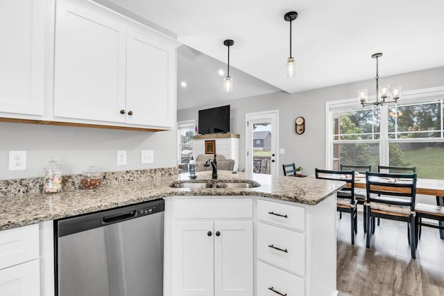 541 Macy Lynn Dr, Clarksville, TN 37042 - kitchen with stainless steel dishwasher, a peninsula, a chandelier, and white cabinets