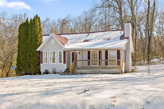 14319 Bluffview Dr, Birchwood, TN 37308 - view of front facade featuring a chimney, a porch, and a metal roof