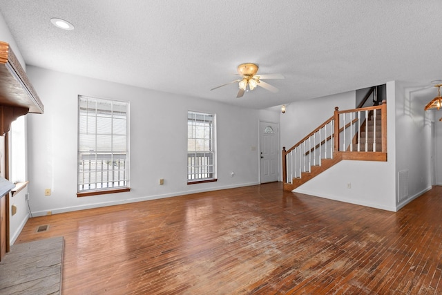 14319 Bluffview Dr, Birchwood, TN 37308 - unfurnished living room with a textured ceiling, ceiling fan, stairs, wood finished floors, and recessed lighting