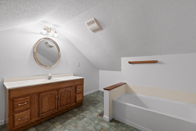 14319 Bluffview Dr, Birchwood, TN 37308 - full bath with vaulted ceiling, a textured ceiling, a bath, and vanity