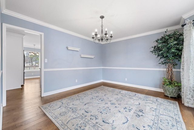 9321 Hopi Trl, Ooltewah, TN 37363 - empty room with a chandelier, wood finished floors, and ornamental molding