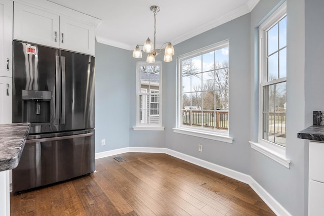 9321 Hopi Trl, Ooltewah, TN 37363 - kitchen with stainless steel fridge, crown molding, dark wood-style floors, white cabinetry, and a chandelier