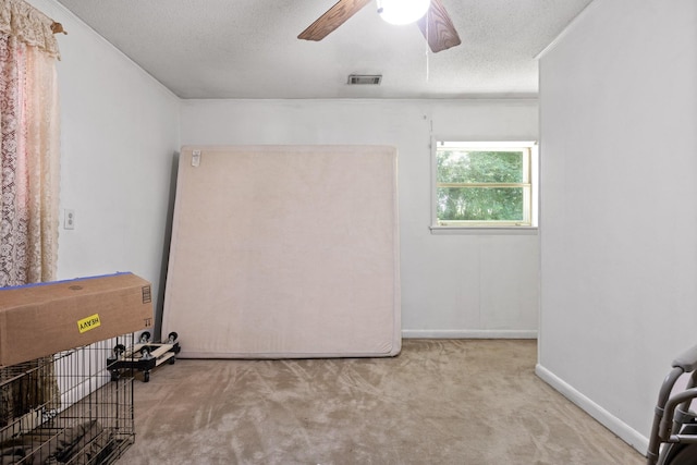 1325 City View St SE, Cleveland, TN 37311 - carpeted spare room featuring ceiling fan, a textured ceiling, and ornamental molding