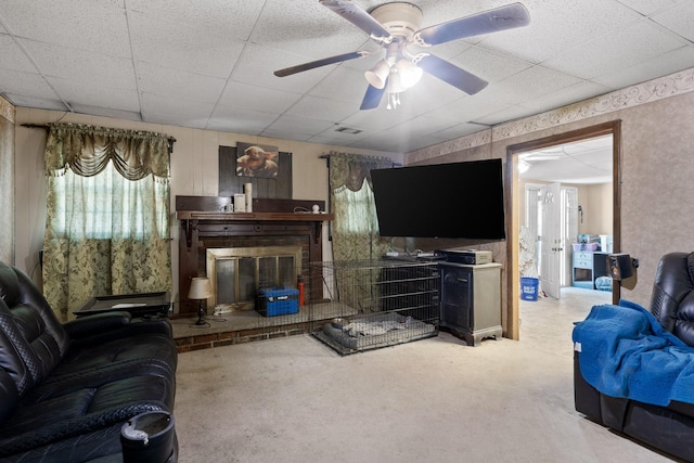 1325 City View St SE, Cleveland, TN 37311 - carpeted living room with a paneled ceiling, a brick fireplace, and a ceiling fan