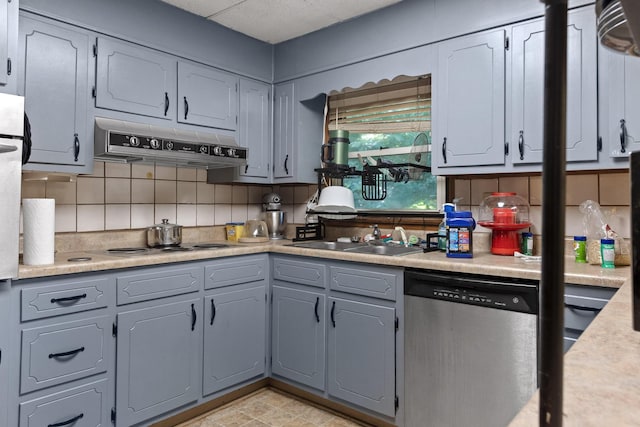 1325 City View St SE, Cleveland, TN 37311 - kitchen featuring stainless steel dishwasher, under cabinet range hood, tasteful backsplash, and light countertops