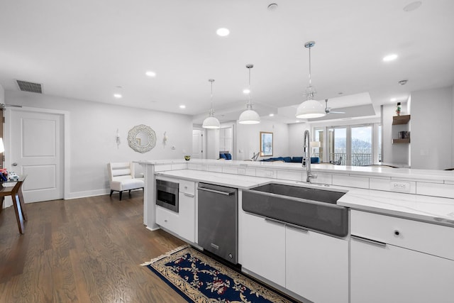 4 Cherokee Blvd Unit 409, Chattanooga, TN 37405 - kitchen with dishwasher, recessed lighting, dark wood finished floors, white cabinetry, and light stone countertops