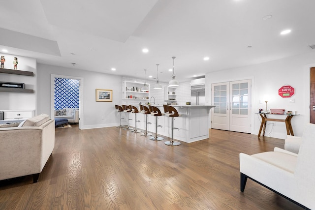 4 Cherokee Blvd Unit 409, Chattanooga, TN 37405 - kitchen featuring a kitchen breakfast bar, dark wood-style flooring, recessed lighting, open shelves, and light countertops