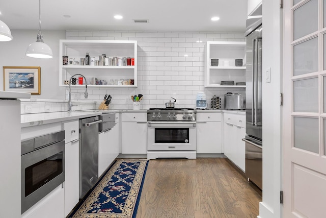 4 Cherokee Blvd Unit 409, Chattanooga, TN 37405 - kitchen with high quality appliances, open shelves, white cabinetry, tasteful backsplash, and recessed lighting