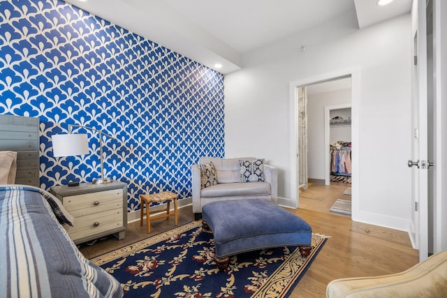 4 Cherokee Blvd Unit 409, Chattanooga, TN 37405 - bedroom with wallpapered walls, an accent wall, recessed lighting, and light wood-type flooring