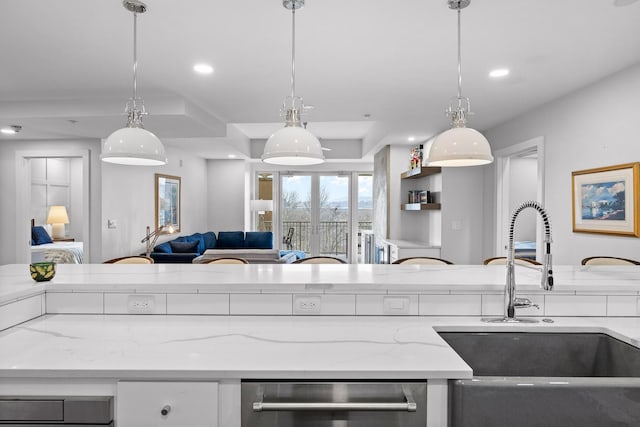 4 Cherokee Blvd Unit 409, Chattanooga, TN 37405 - kitchen with open floor plan, light stone counters, recessed lighting, and hanging light fixtures
