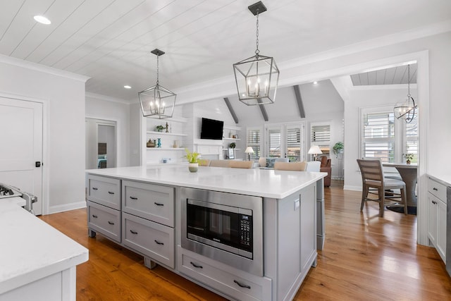 2305 Weeping Willow Dr, Ooltewah, TN 37363 - kitchen featuring stainless steel microwave, gray cabinets, a chandelier, light countertops, and recessed lighting