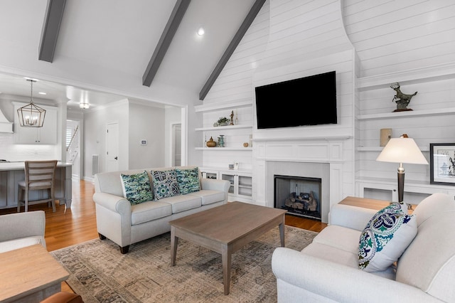 2305 Weeping Willow Dr, Ooltewah, TN 37363 - living room featuring wood finished floors, a fireplace, recessed lighting, stairs, and a chandelier