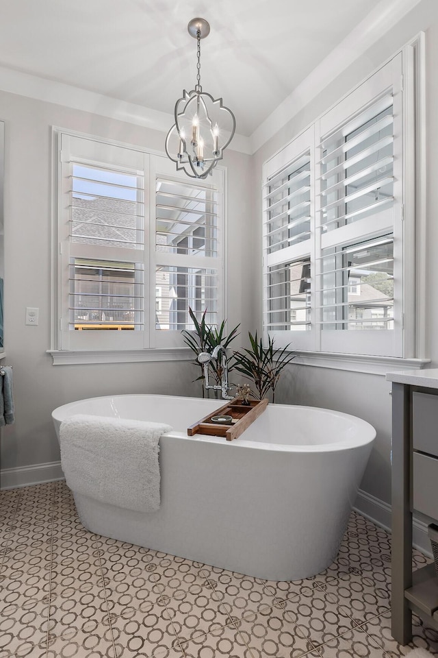 2305 Weeping Willow Dr, Ooltewah, TN 37363 - bathroom featuring a chandelier, plenty of natural light, and a freestanding tub