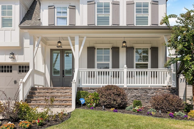 2305 Weeping Willow Dr, Ooltewah, TN 37363 - view of front of house with a porch, a garage, and board and batten siding