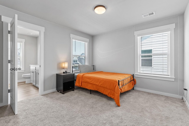 2129 Firelight Way, Ooltewah, TN 37363 - bedroom with carpet floors, multiple windows, and ensuite bathroom