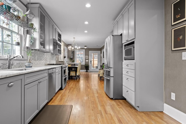 402 Fairview Dr, Dalton, GA 30720 - kitchen with stainless steel appliances, gray cabinets, a chandelier, light wood finished floors, and recessed lighting