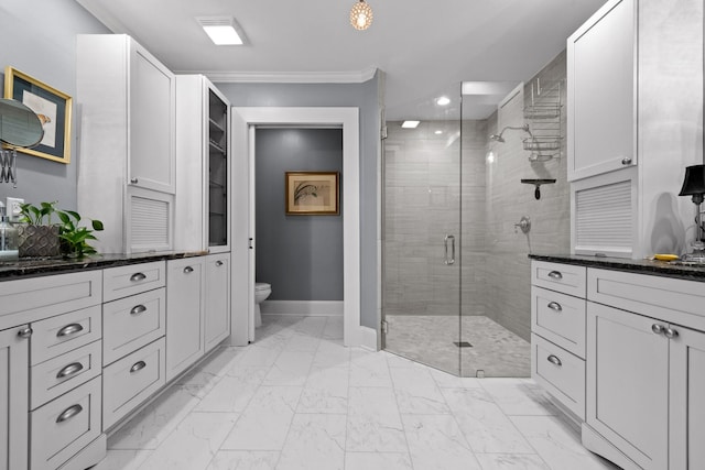 402 Fairview Dr, Dalton, GA 30720 - bathroom featuring ornamental molding, marble look tile flooring, a shower stall, vanity, and recessed lighting
