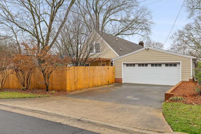 402 Fairview Dr, Dalton, GA 30720 - view of home's exterior with a chimney and brick siding