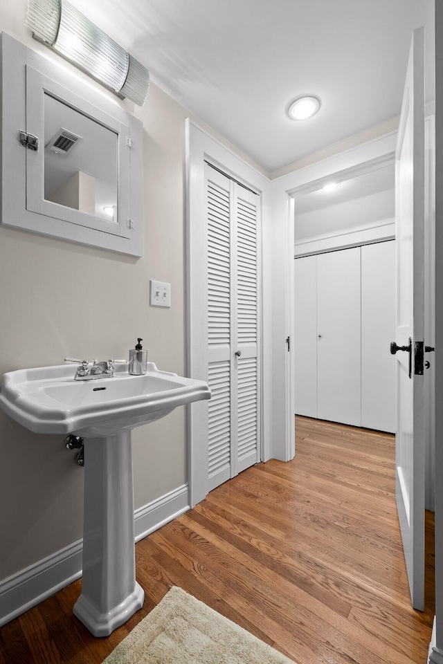 402 Fairview Dr, Dalton, GA 30720 - bathroom with wood finished floors and baseboards