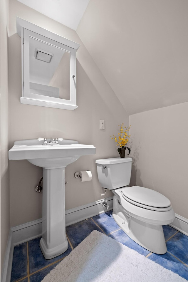 402 Fairview Dr, Dalton, GA 30720 - bathroom featuring toilet and lofted ceiling