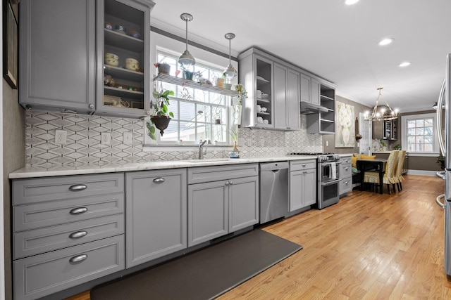 402 Fairview Dr, Dalton, GA 30720 - kitchen with appliances with stainless steel finishes, gray cabinetry, ornamental molding, a chandelier, and light countertops