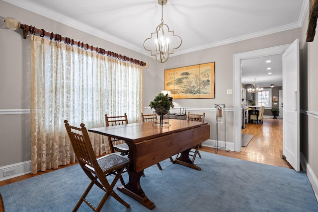 402 Fairview Dr, Dalton, GA 30720 - dining space featuring a chandelier, wood finished floors, and ornamental molding