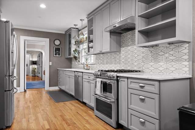 402 Fairview Dr, Dalton, GA 30720 - kitchen with appliances with stainless steel finishes, under cabinet range hood, gray cabinets, open shelves, and crown molding