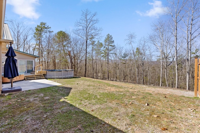 1080 Harp Switch Rd, Chickamauga, GA 30707 - view of grassy yard with a covered pool, a patio, a view of trees, and a wooden deck