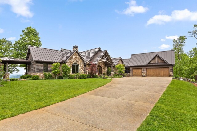 6835 Jasper Highlands Blvd, Jasper, TN 37347 - view of front of home with a standing seam roof, stone siding, a chimney, an attached garage, and concrete driveway
