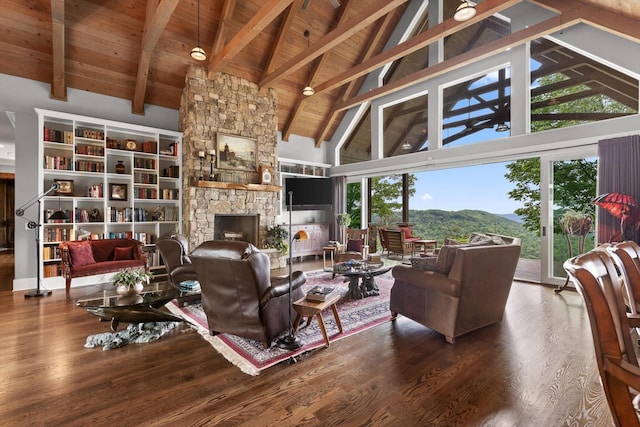 6835 Jasper Highlands Blvd, Jasper, TN 37347 - living area featuring high vaulted ceiling, wood finished floors, a stone fireplace, and a wood ceiling with exposed beams
