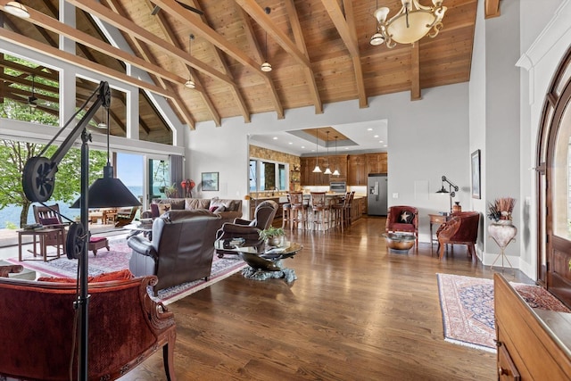 6835 Jasper Highlands Blvd, Jasper, TN 37347 - living area with high vaulted ceiling, a chandelier, a wood ceiling with exposed beams, and dark wood-type flooring