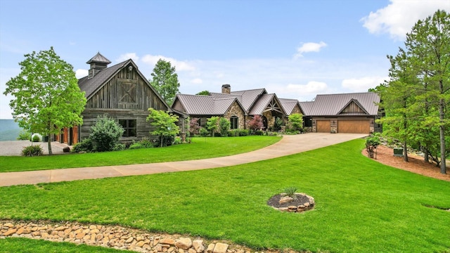 6835 Jasper Highlands Blvd, Jasper, TN 37347 - view of front facade with a standing seam roof, a front yard, driveway, a metal roof, and an attached garage