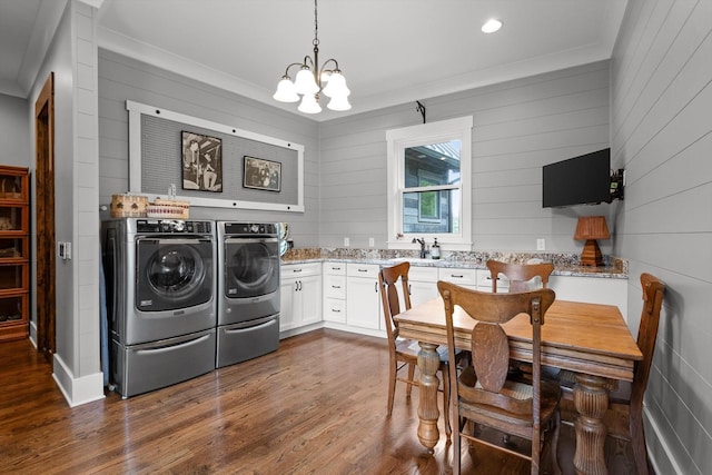 6835 Jasper Highlands Blvd, Jasper, TN 37347 - laundry room with washer and dryer, a chandelier, dark wood-style floors, crown molding, and wooden walls