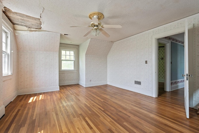 20 Ridge Rd, Chattanooga, TN 37411 - spare room with wood finished floors, a textured ceiling, ceiling fan, and wallpapered walls