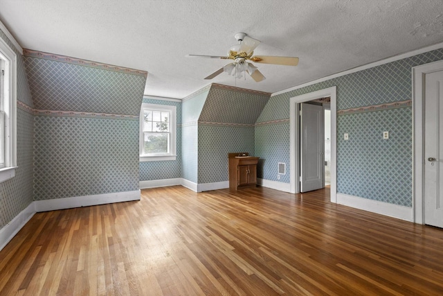 20 Ridge Rd, Chattanooga, TN 37411 - additional living space featuring wood-type flooring, ceiling fan, a textured ceiling, and wallpapered walls