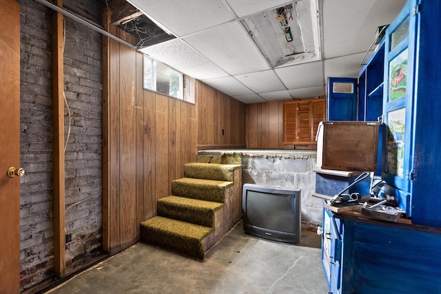 20 Ridge Rd, Chattanooga, TN 37411 - misc room featuring concrete flooring, wood walls, a paneled ceiling, and stairway