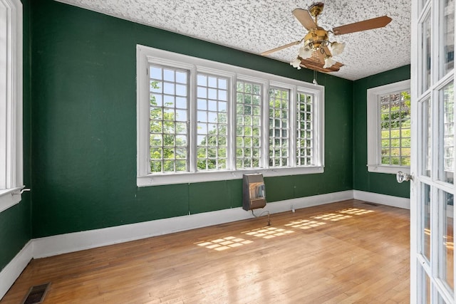20 Ridge Rd, Chattanooga, TN 37411 - empty room with plenty of natural light, ceiling fan, and wood finished floors