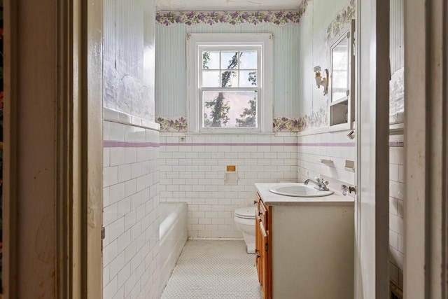 20 Ridge Rd, Chattanooga, TN 37411 - full bathroom featuring vanity, wainscoting, a tub to relax in, tile patterned flooring, and wallpapered walls