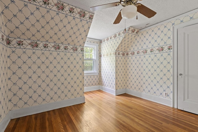 20 Ridge Rd, Chattanooga, TN 37411 - additional living space with wood finished floors, ceiling fan, a textured ceiling, and wallpapered walls