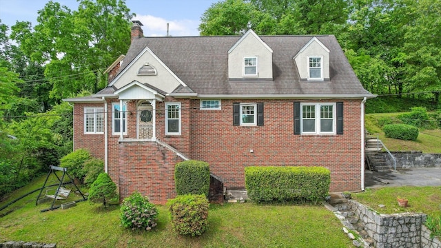 20 Ridge Rd, Chattanooga, TN 37411 - view of front of house with brick siding, a front yard, a chimney, and stairway