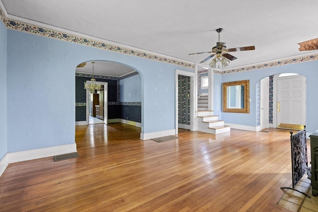 20 Ridge Rd, Chattanooga, TN 37411 - empty room with arched walkways, wood-type flooring, stairs, ceiling fan, and ornamental molding
