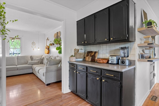 4338 Comet Trl, Hixson, TN 37343 - kitchen featuring open shelves, crown molding, light wood-style floors, backsplash, and light countertops