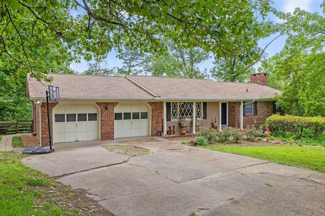 4338 Comet Trl, Hixson, TN 37343 - ranch-style home featuring an attached garage, concrete driveway, a chimney, brick siding, and roof with shingles