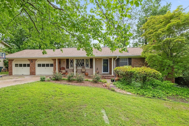 4338 Comet Trl, Hixson, TN 37343 - ranch-style home featuring an attached garage, a front lawn, concrete driveway, and brick siding