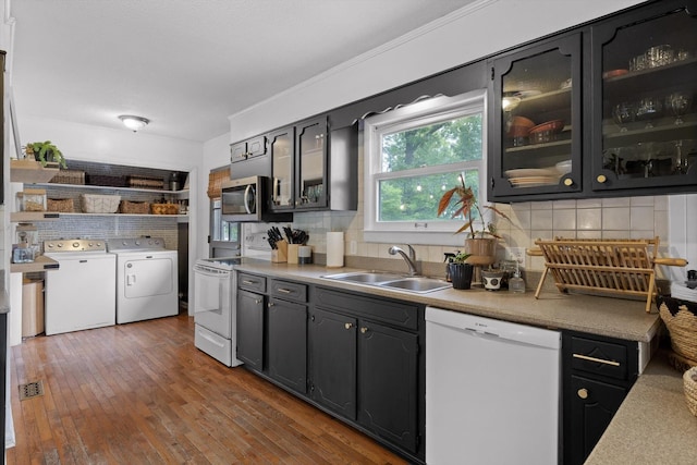 4338 Comet Trl, Hixson, TN 37343 - kitchen with white appliances, washer and clothes dryer, tasteful backsplash, and glass insert cabinets