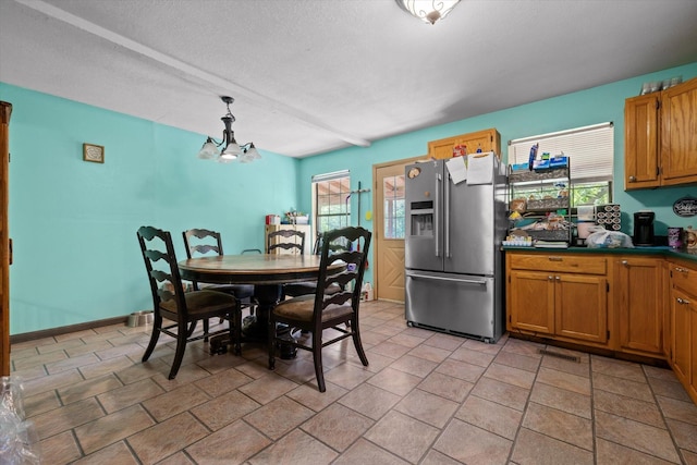 553 Back Valley Rd, Trenton, GA 30752 - dining space with plenty of natural light, a chandelier, and a textured ceiling