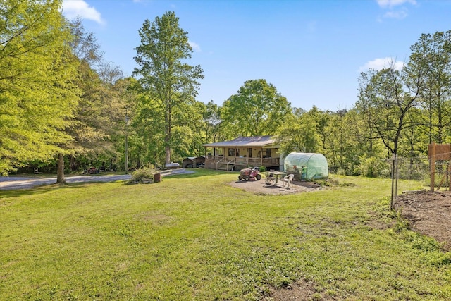 553 Back Valley Rd, Trenton, GA 30752 - view of grassy yard featuring a wooden deck, a fire pit, and a forest view