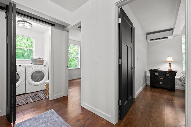 216 Trenton St, Chattanooga, TN 37415 - laundry room with a wall mounted AC, washing machine and dryer, and dark wood finished floors