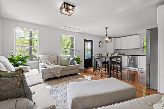 216 Trenton St, Chattanooga, TN 37415 - living room featuring dark wood-style flooring and a chandelier