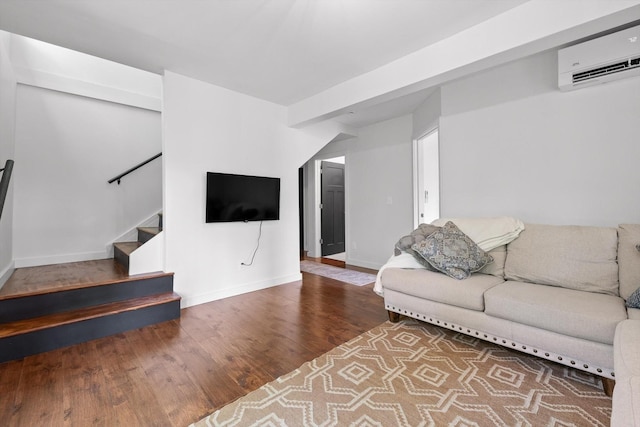 216 Trenton St, Chattanooga, TN 37415 - living area with an AC wall unit, wood finished floors, and stairs